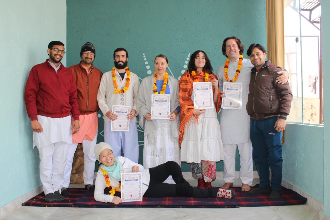 Graduating students and teachers together at a certificate ceremony at Sri Yoga Ashram Rishikesh